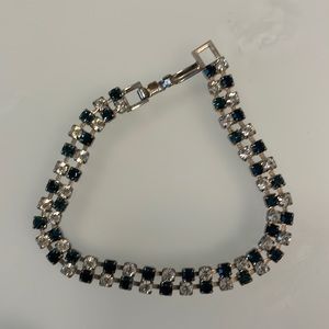 Crystal and sapphire costume bracelet set in white metal